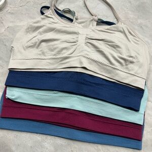 5 items - True & Co. Sports Bras in Cream, D Blue, mint, burgundy & blue.